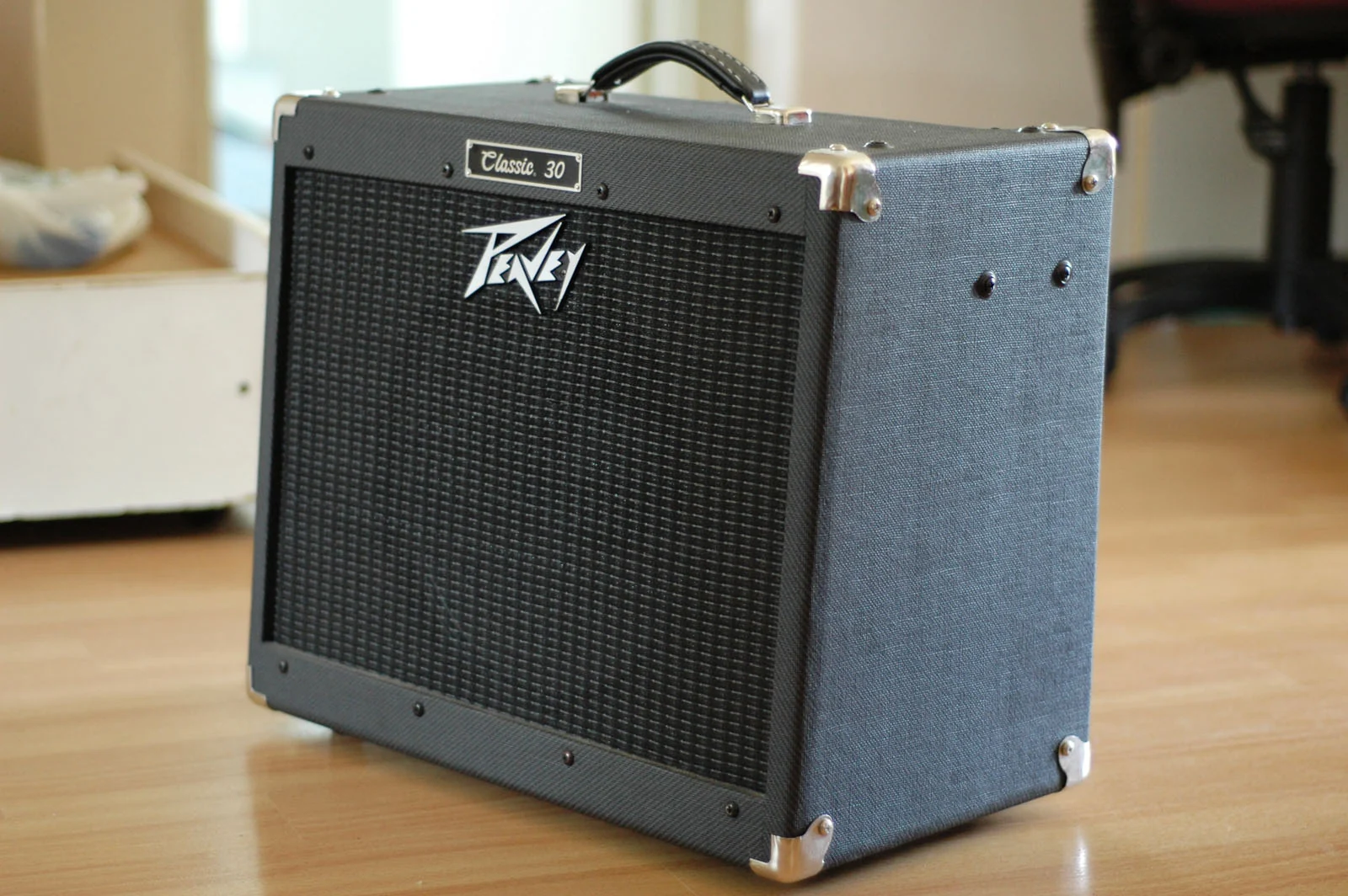 A Peavey Classic guitar amplifier with its logo visible on the grille